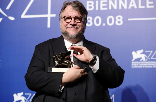 poses with the XXX award for XXX at the Award Winners photocall during the 74th Venice Film Festival at Sala Casino on September 9, 2017 in Venice, Italy.